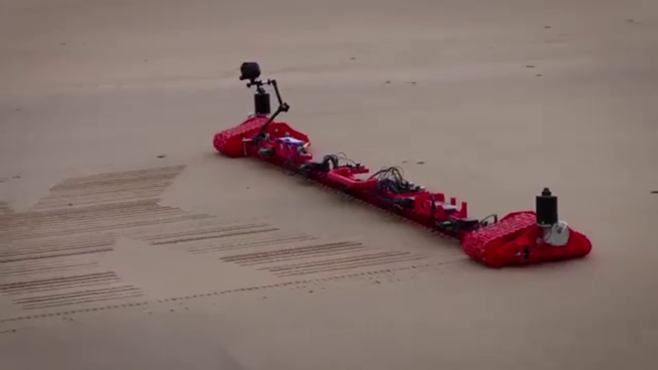 Құмда сурет салатын робот